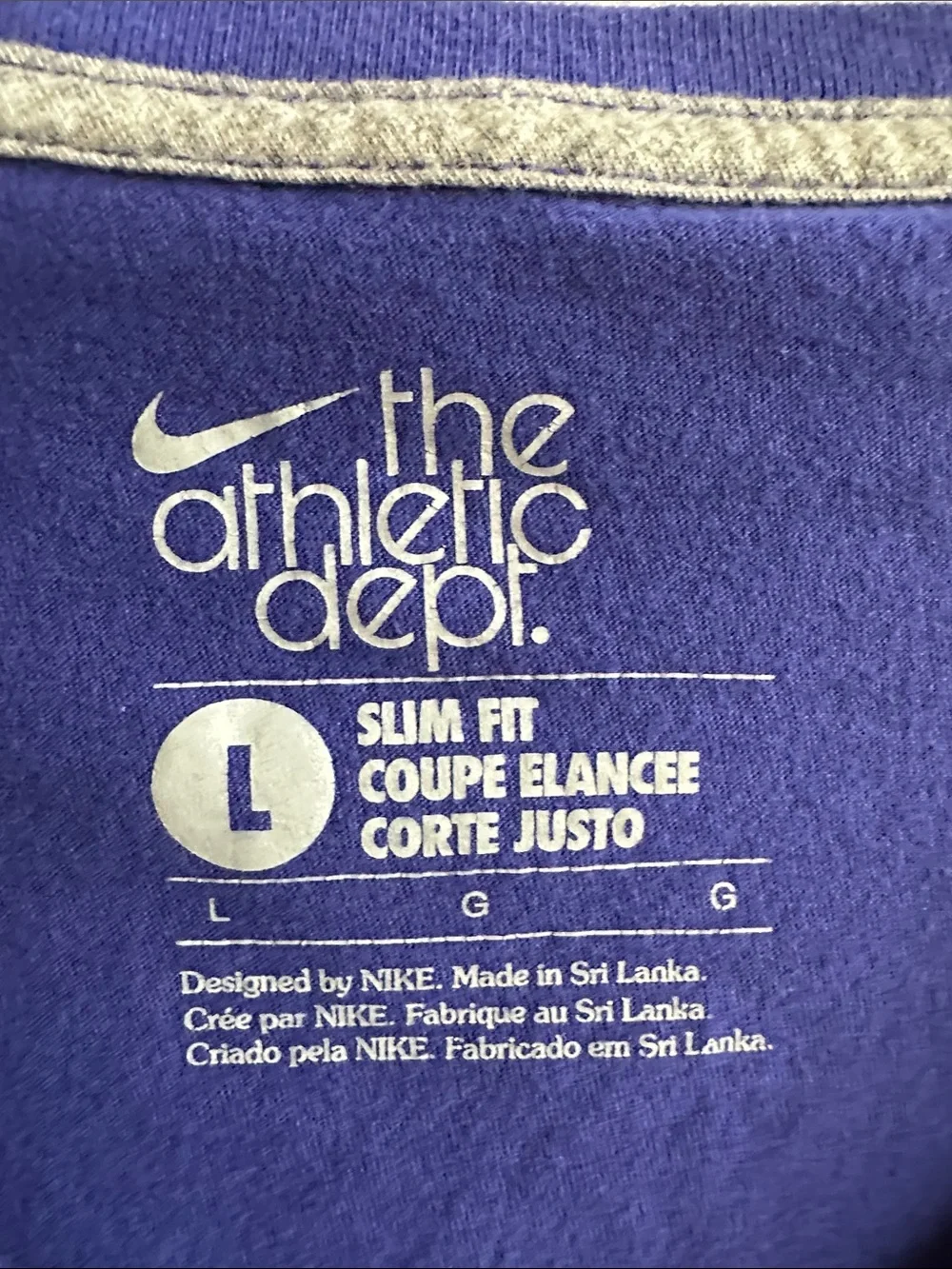 Nike blue V-neck athletic T-shirt with a white embroidered swoosh logo - Picture 5 of 7